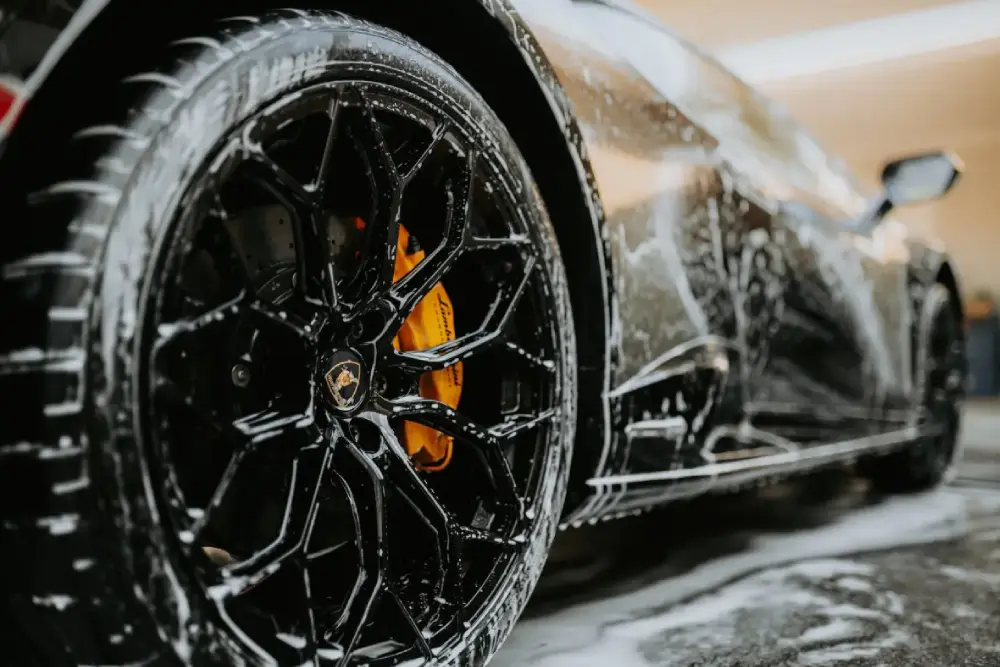 close up shot of a car wheel during car wash